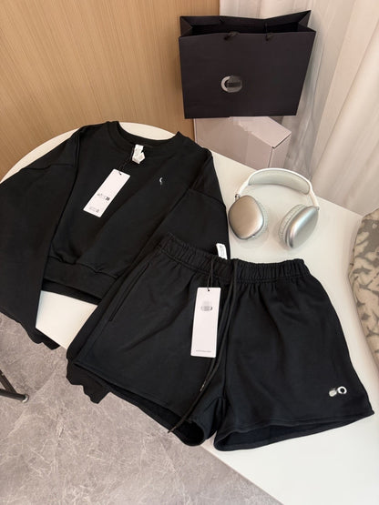 GMABCD women's cotton-rich terry Black shorts styled with matching sweatshirt